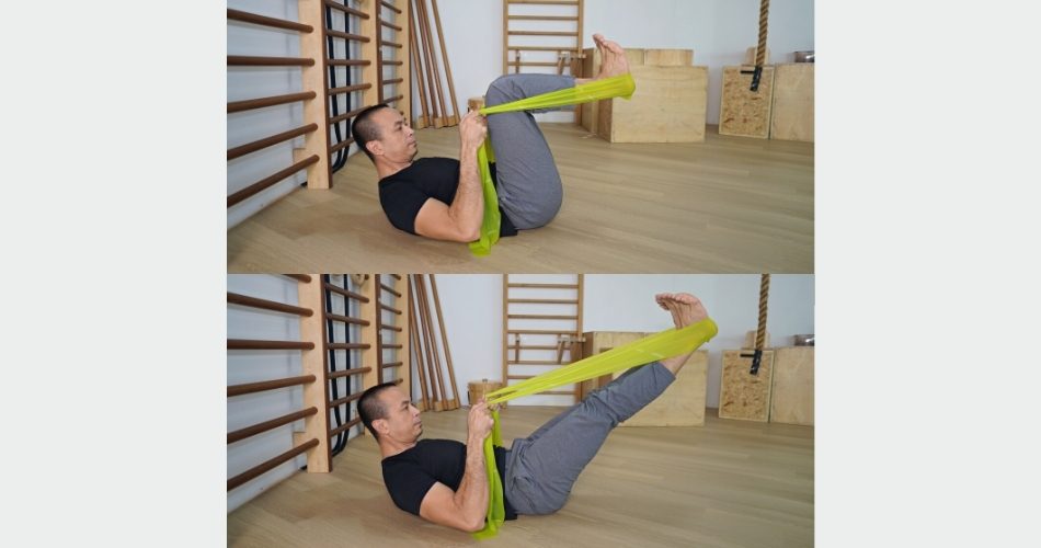 Michel demonstrating leg and footwork heels with the elastic band