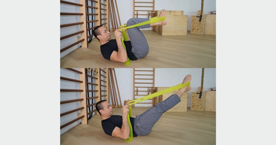 Michel demonstrating leg and footwork arches with the elastic band
