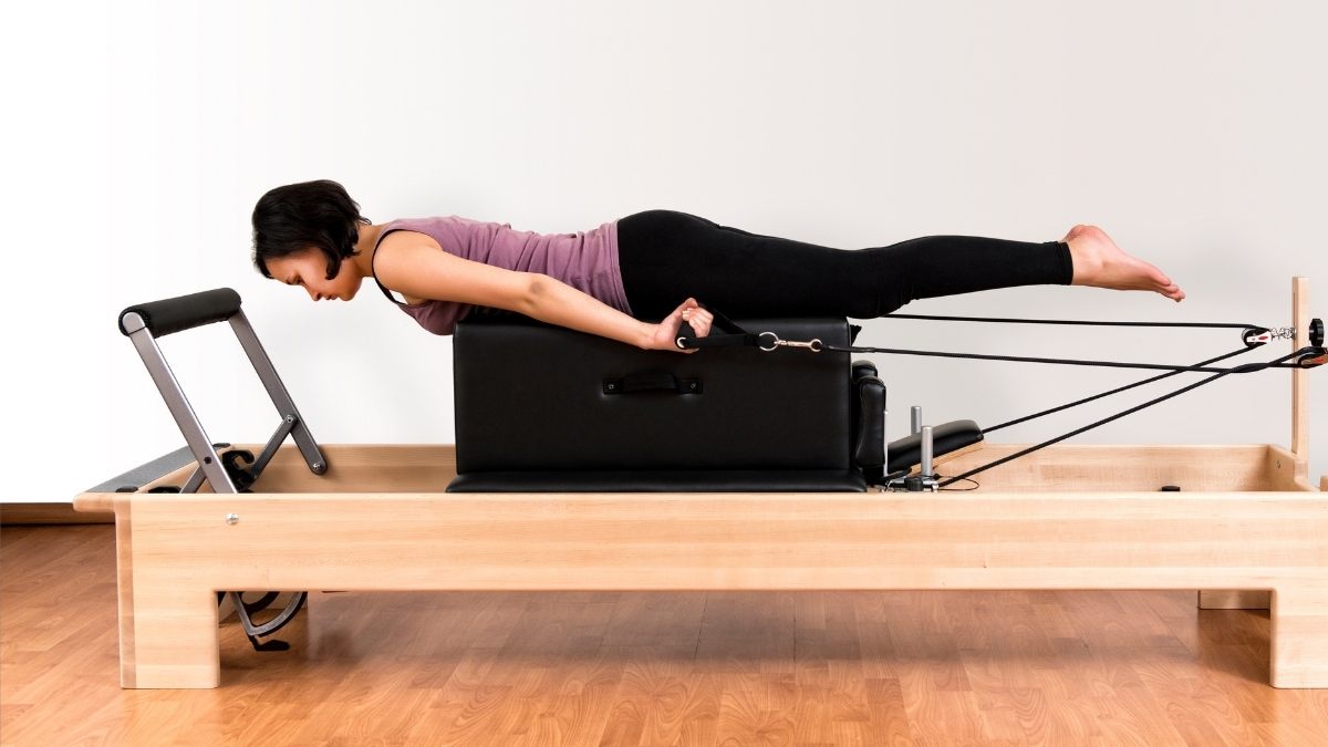 Feet In Straps on the Reformer  Pseudo-Closed Chain Exercise 